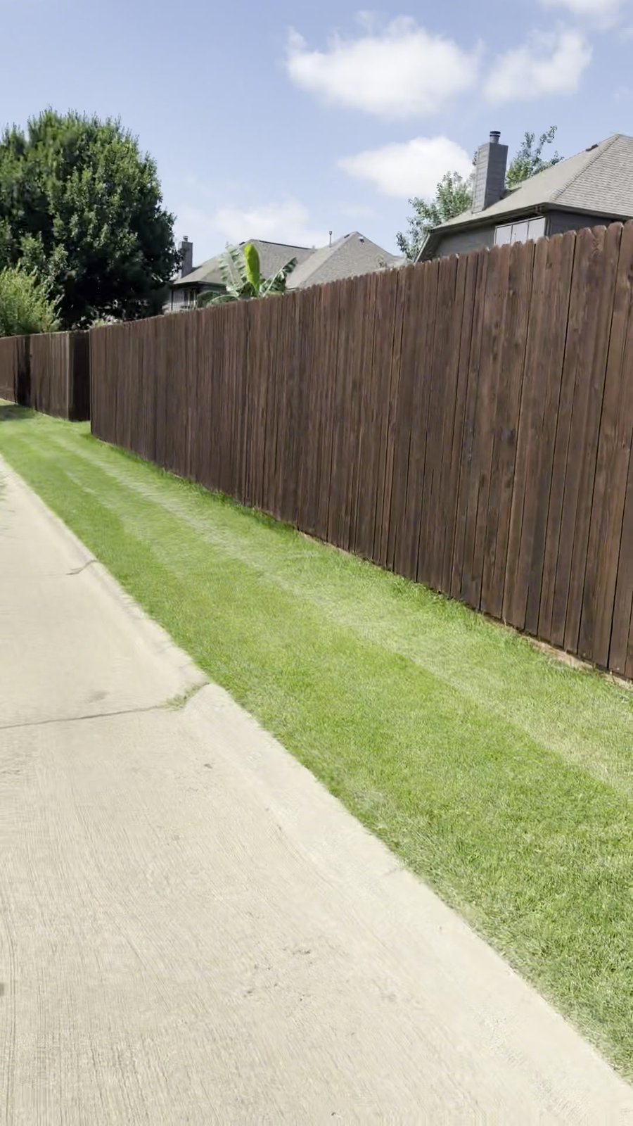 Fence pressure washed, repaired and stained