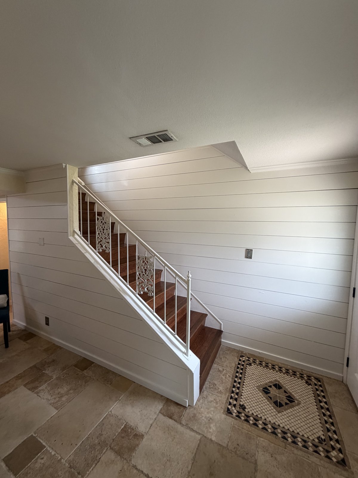 Painted shiplap stair wall