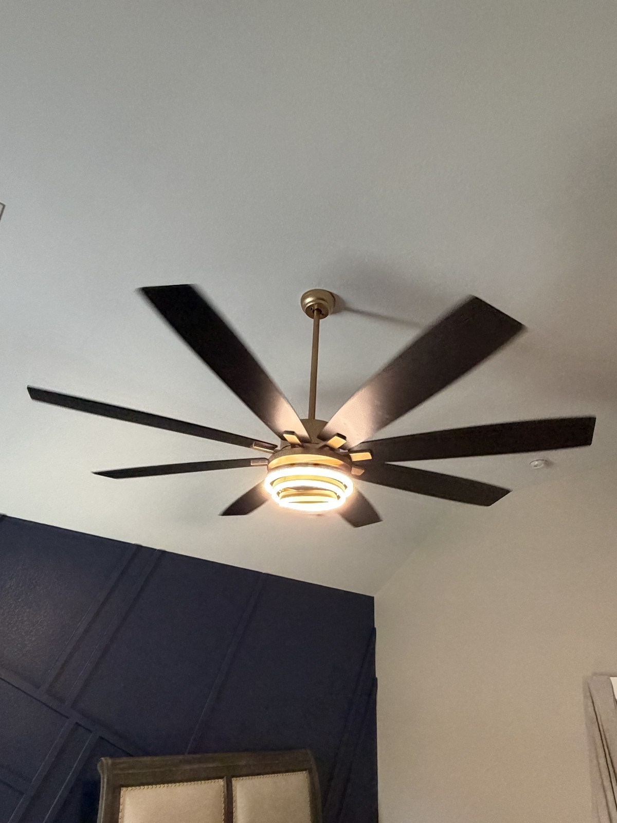 Gold ceiling fan with integrated LED light installed