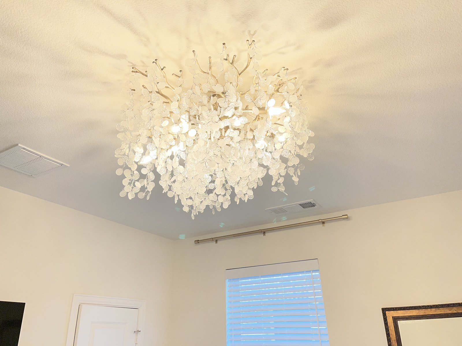 New ceiling light fixture installed in bedroom