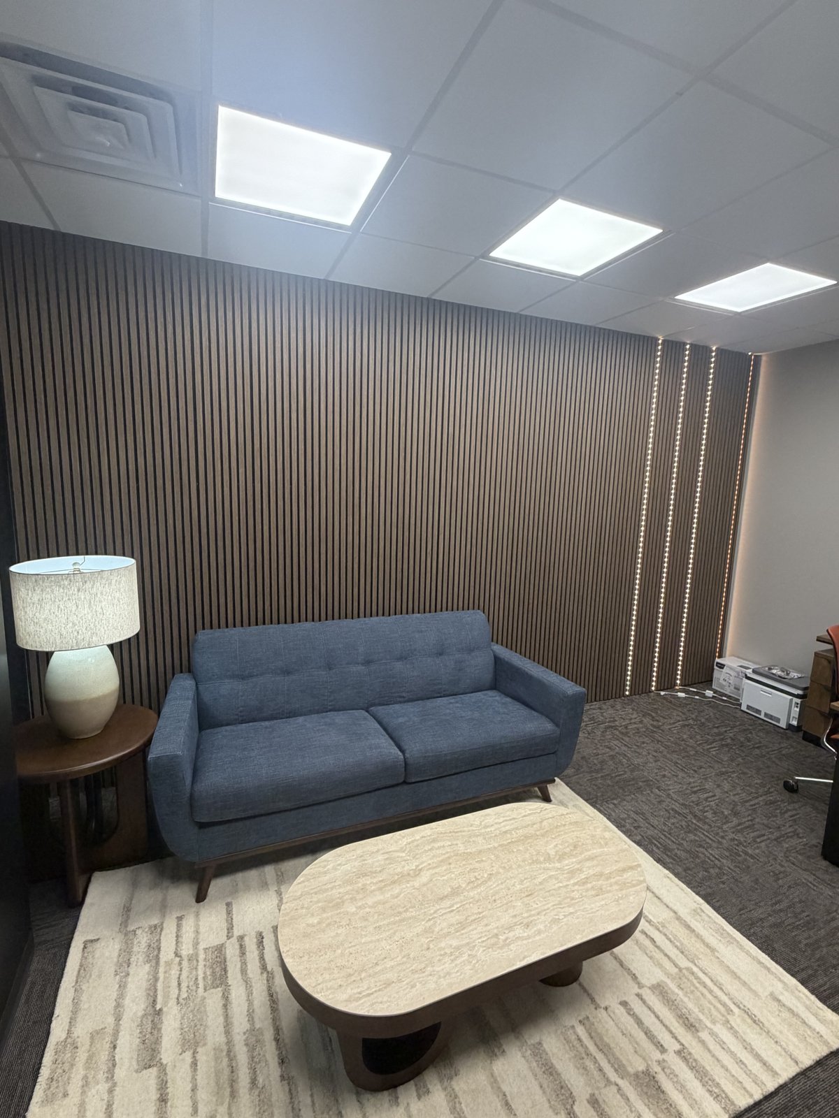Wood slat acoustic wall with LED accent lighting