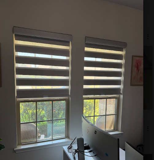 Brackets set true, shades hung level and even across both windows.